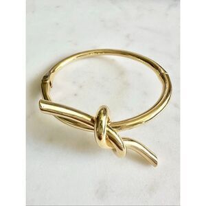 Sleek gold color tie the knot bangle bracelet